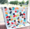 Simple quilt blocks look amazing with stitched with colorful scraps. The Jazz quilt block highlights HST's and straight stitches. Free pattern download.