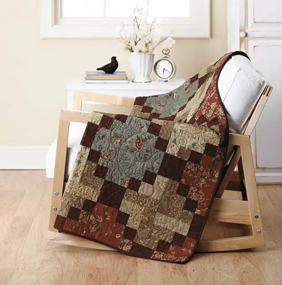 Traditional Homebound Quilt Pattern in warm colors.