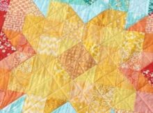 Turn your fabric leftovers into an amazing baby quilt with the Scrappy Posie pattern.