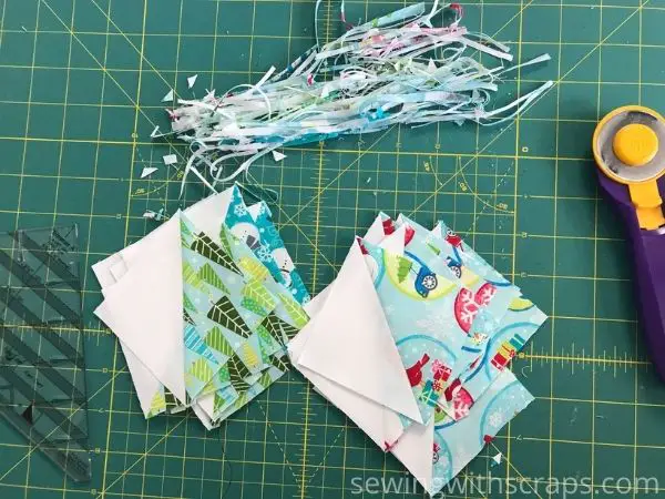 Trimming up half square triangles for the Star & Heart Present Block in the Handmade with Love quilt along.