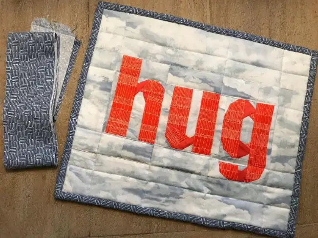 Paper Pieced Hug Mini Quilt